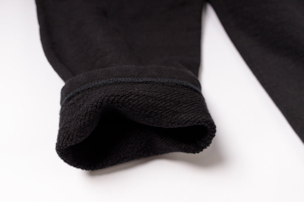 Close-up of a black fabric texture on a white background