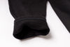 Close-up of a black fabric texture on a white background