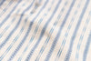 Close-up of fabric with blue and beige striped pattern