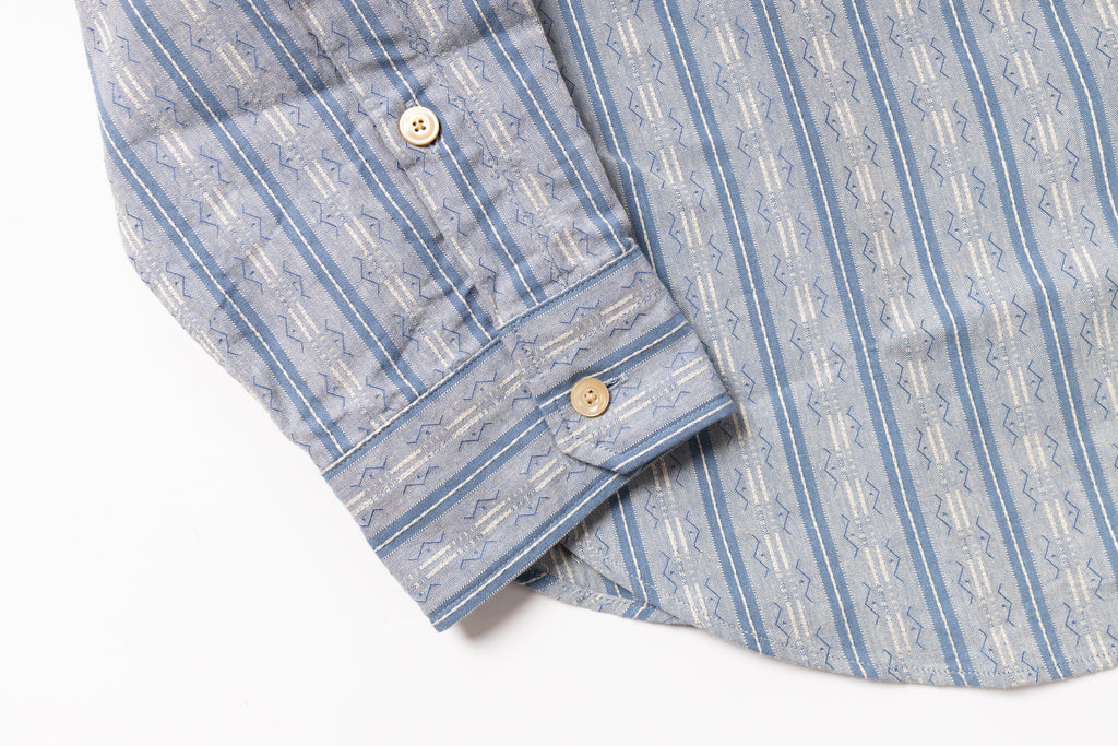 Folded blue and white striped shirt on a white background