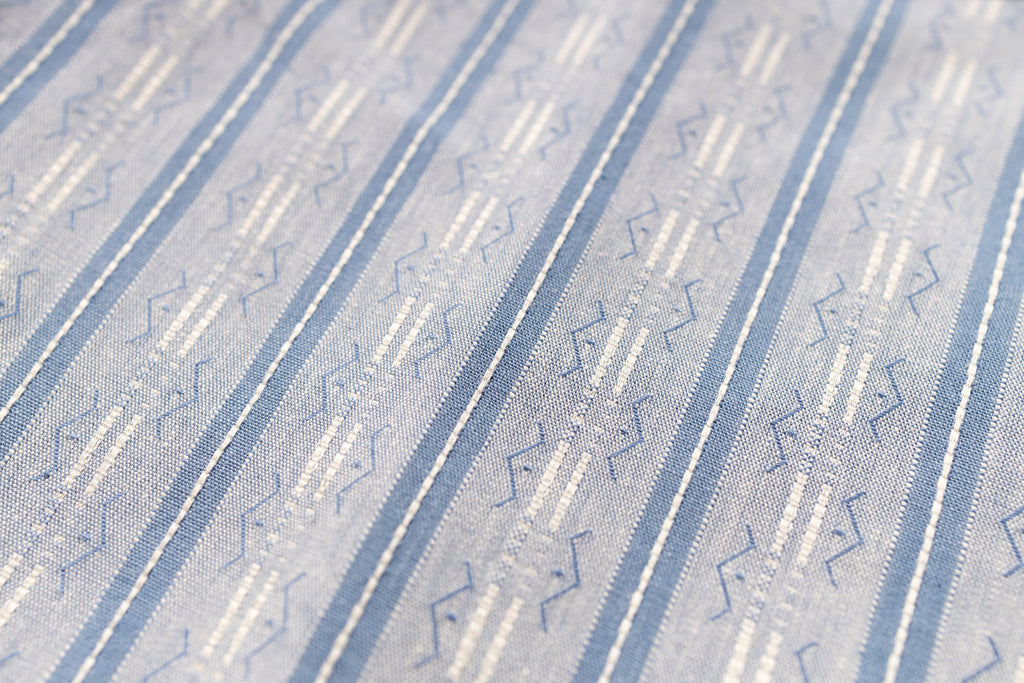 Close-up of a textured fabric with a subtle pattern