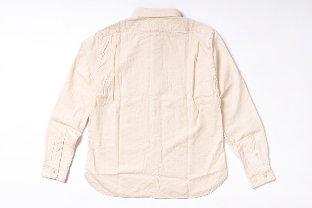 Beige quilted jacket on a white background