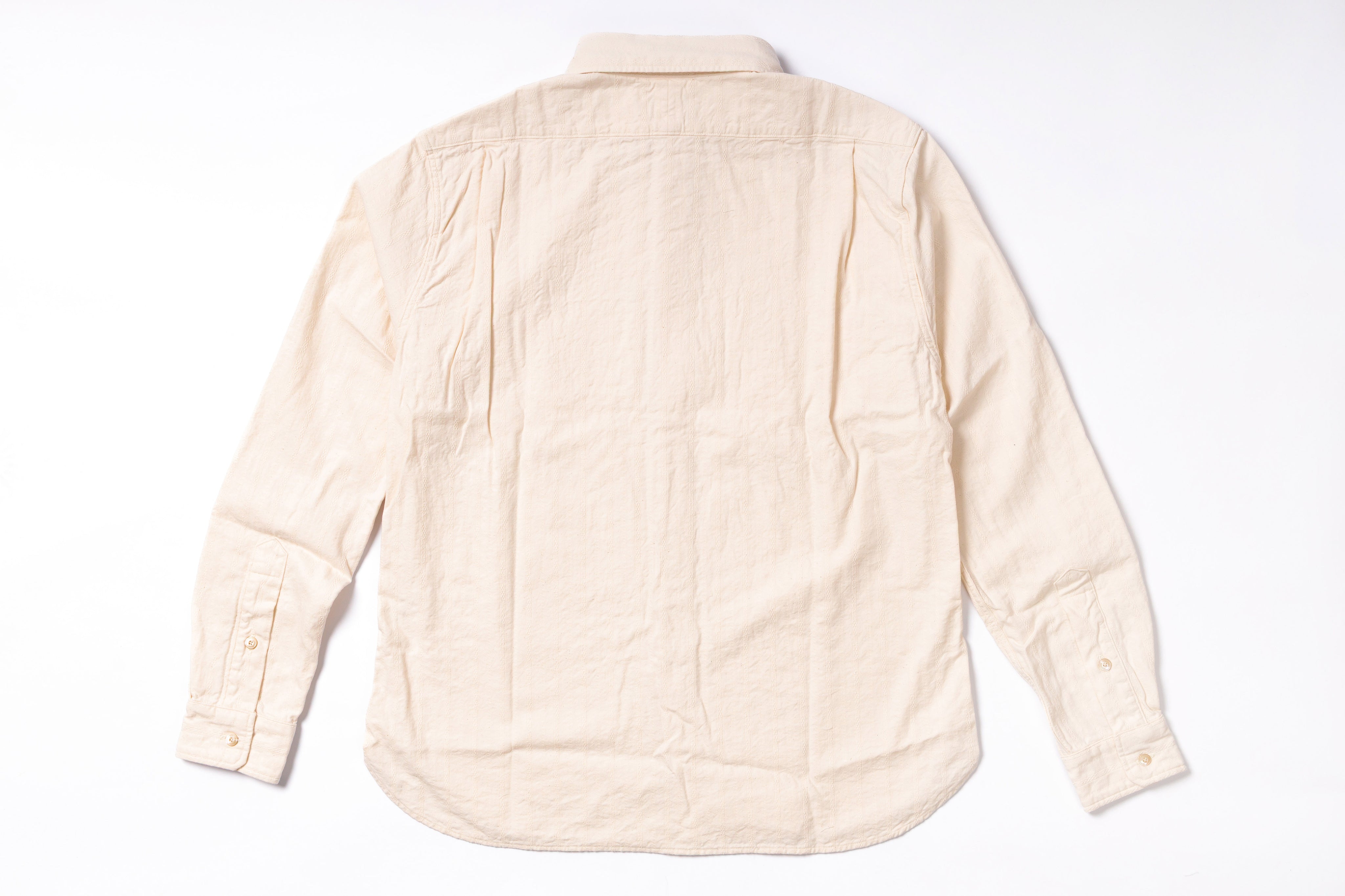 Beige quilted jacket on a white background