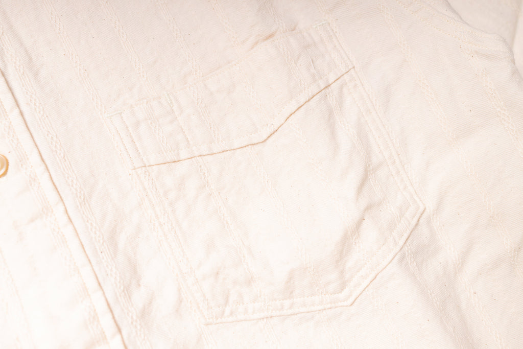 Close-up of a light pink fabric texture