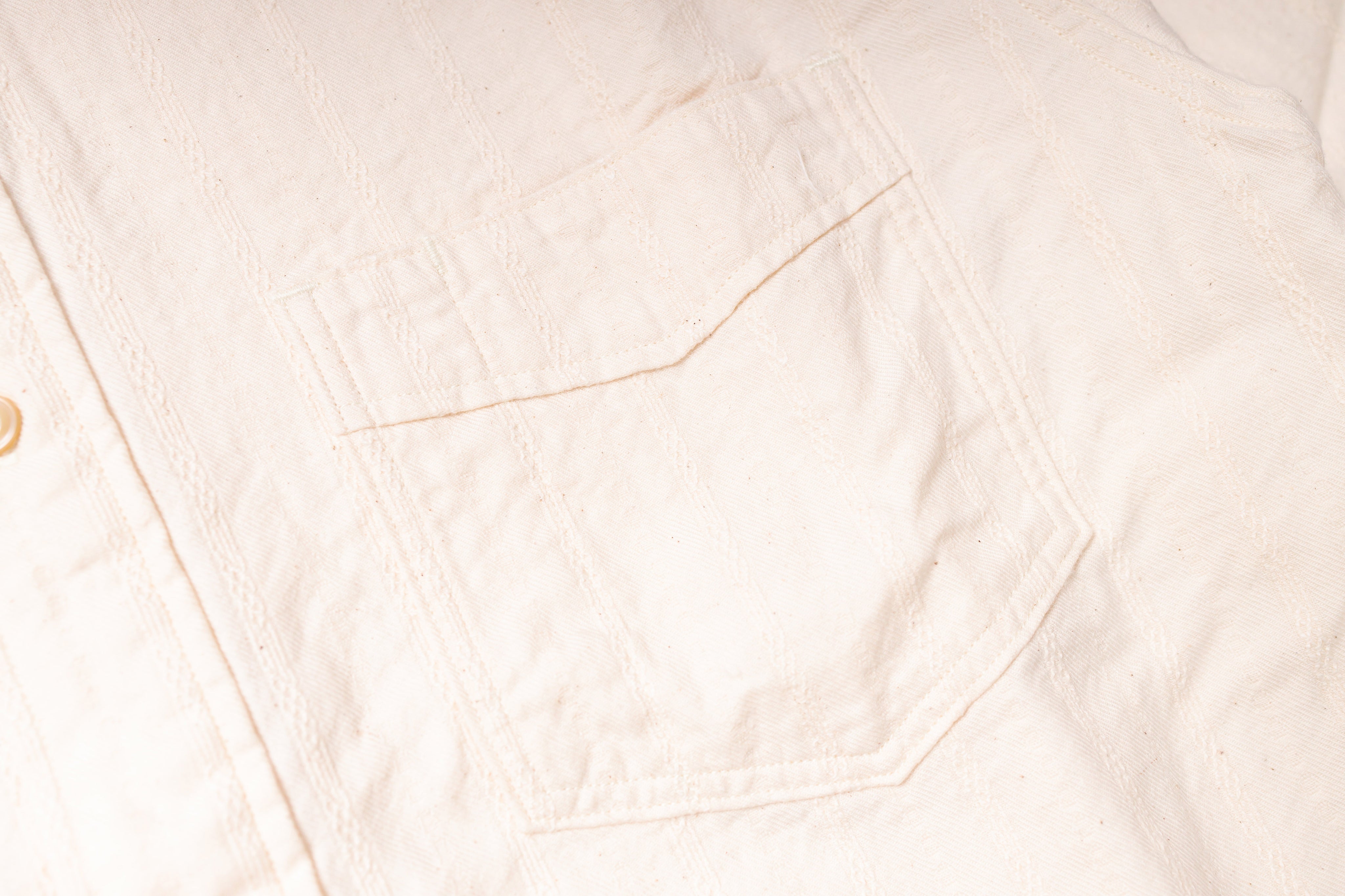 Close-up of a light pink fabric texture