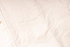 Close-up of a light pink fabric texture