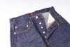 Close-up of a blue denim jacket with buttons on a white background