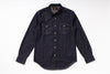 A dark indigo denim western-style shirt jacket with long sleeves, button-down front, and two chest pockets, laid flat on a white background.