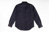 A dark indigo denim long-sleeve shirt shown from the back, laid flat on a white background.