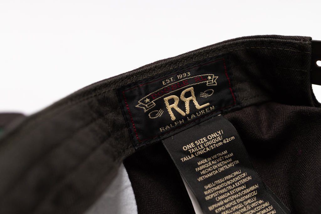 Close-up of a black Ralph Lauren garment interior showing the brand label and care tag.