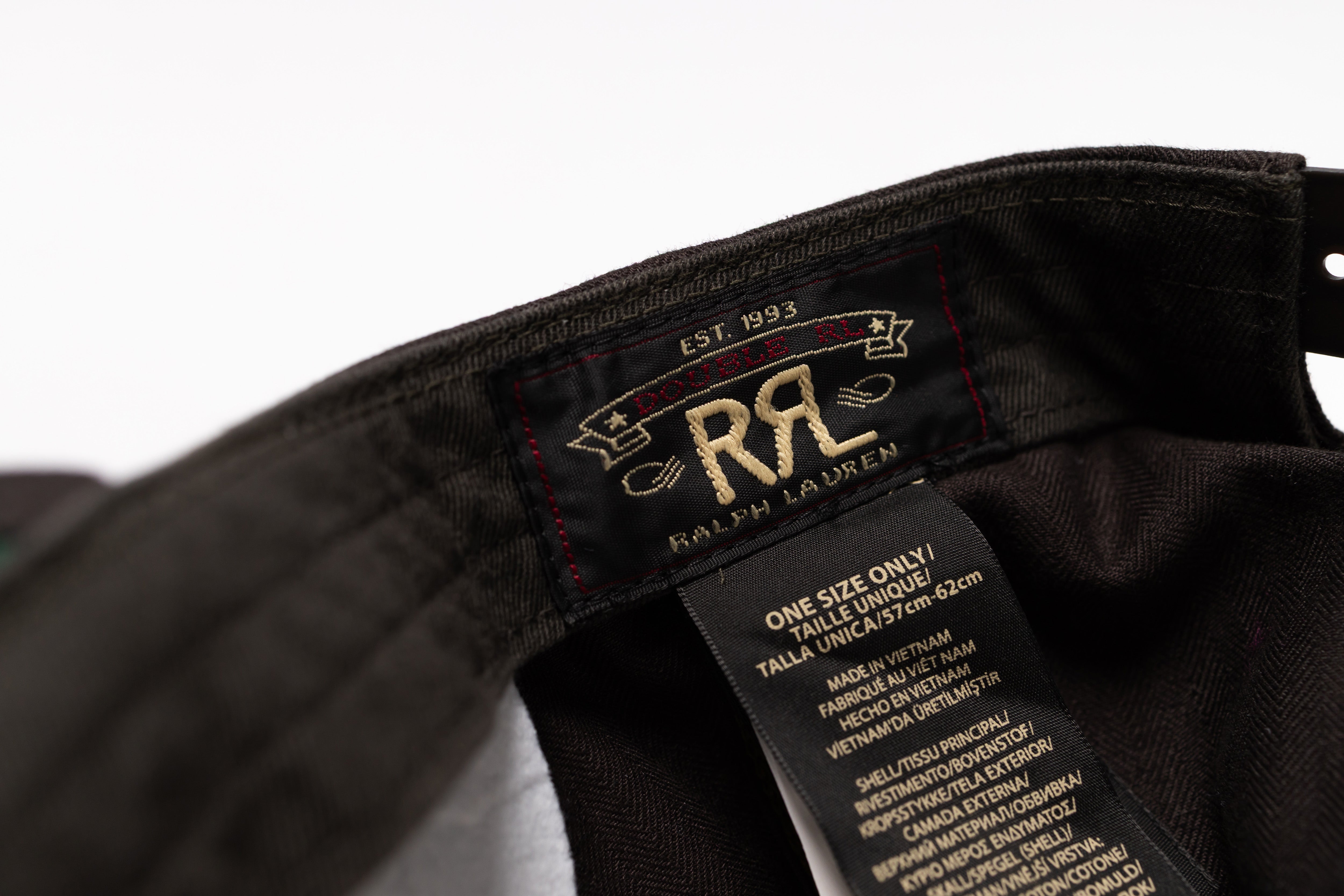 Close-up of a black Ralph Lauren garment interior showing the brand label and care tag.