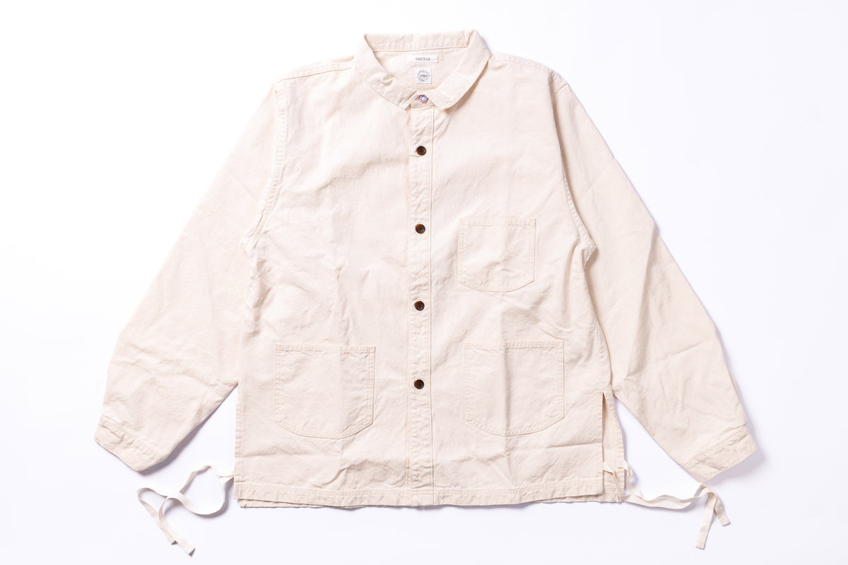 Beige jacket with button details on a white background