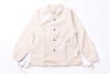 Beige jacket with button details on a white background