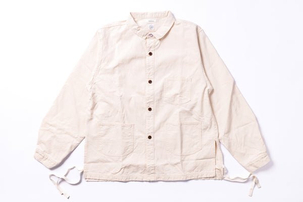 Beige jacket with button details on a white background