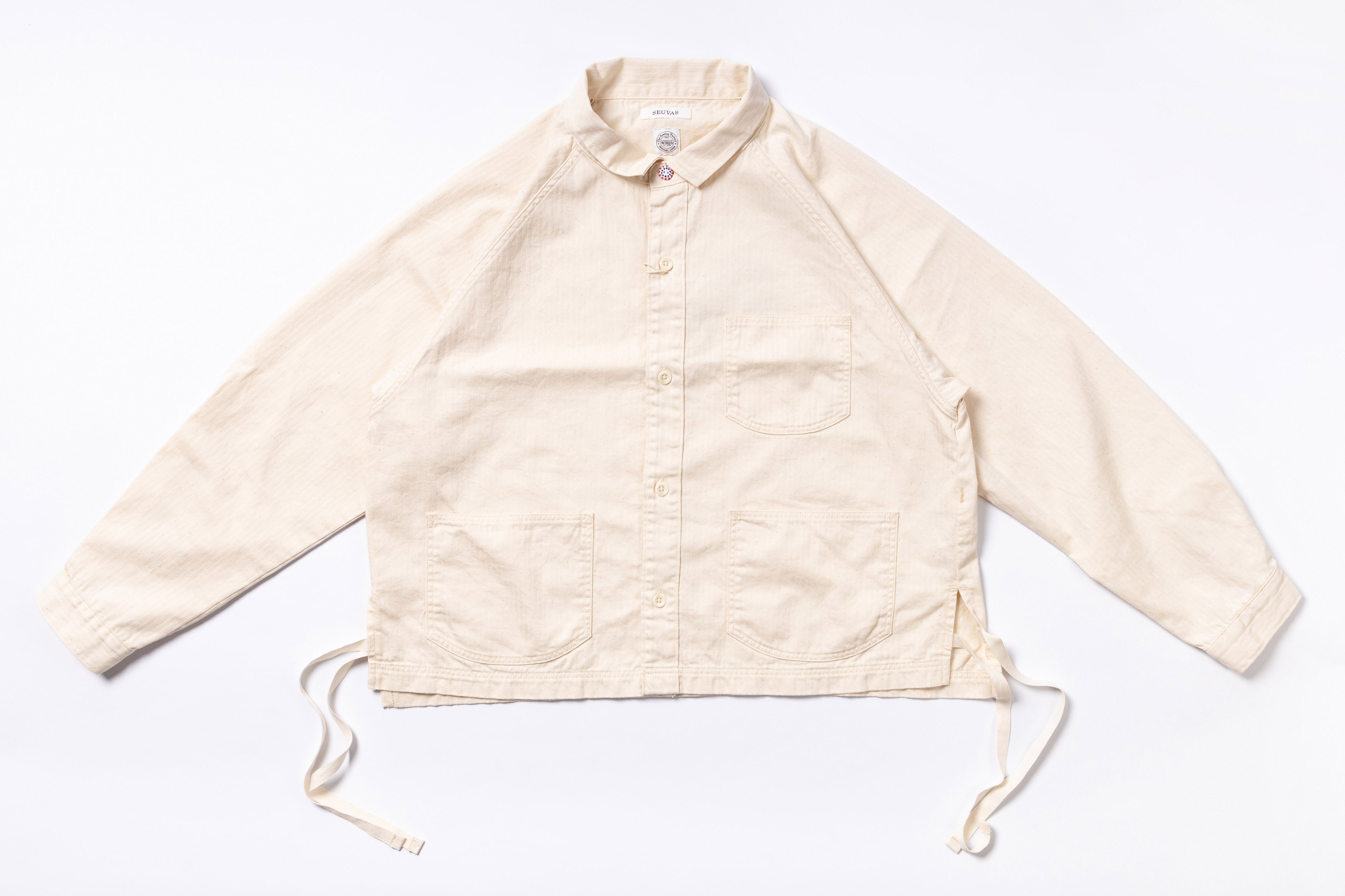 Beige jacket with drawstrings on a white background