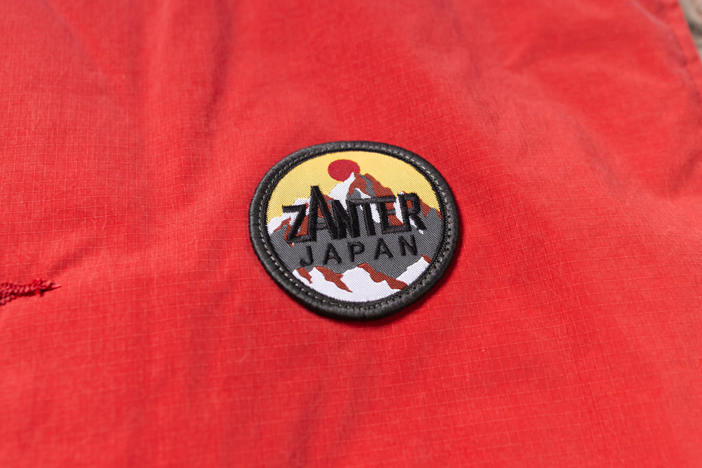 Zamter Japan patch on a red fabric background