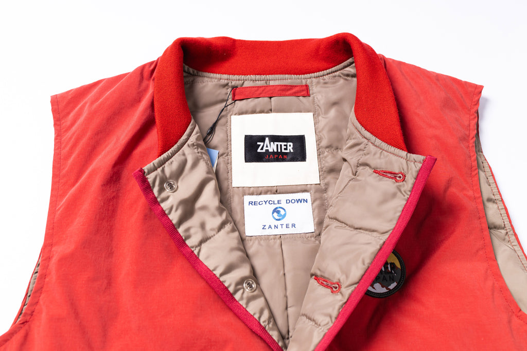 Red vest with beige interior and Zanter branding on a white background