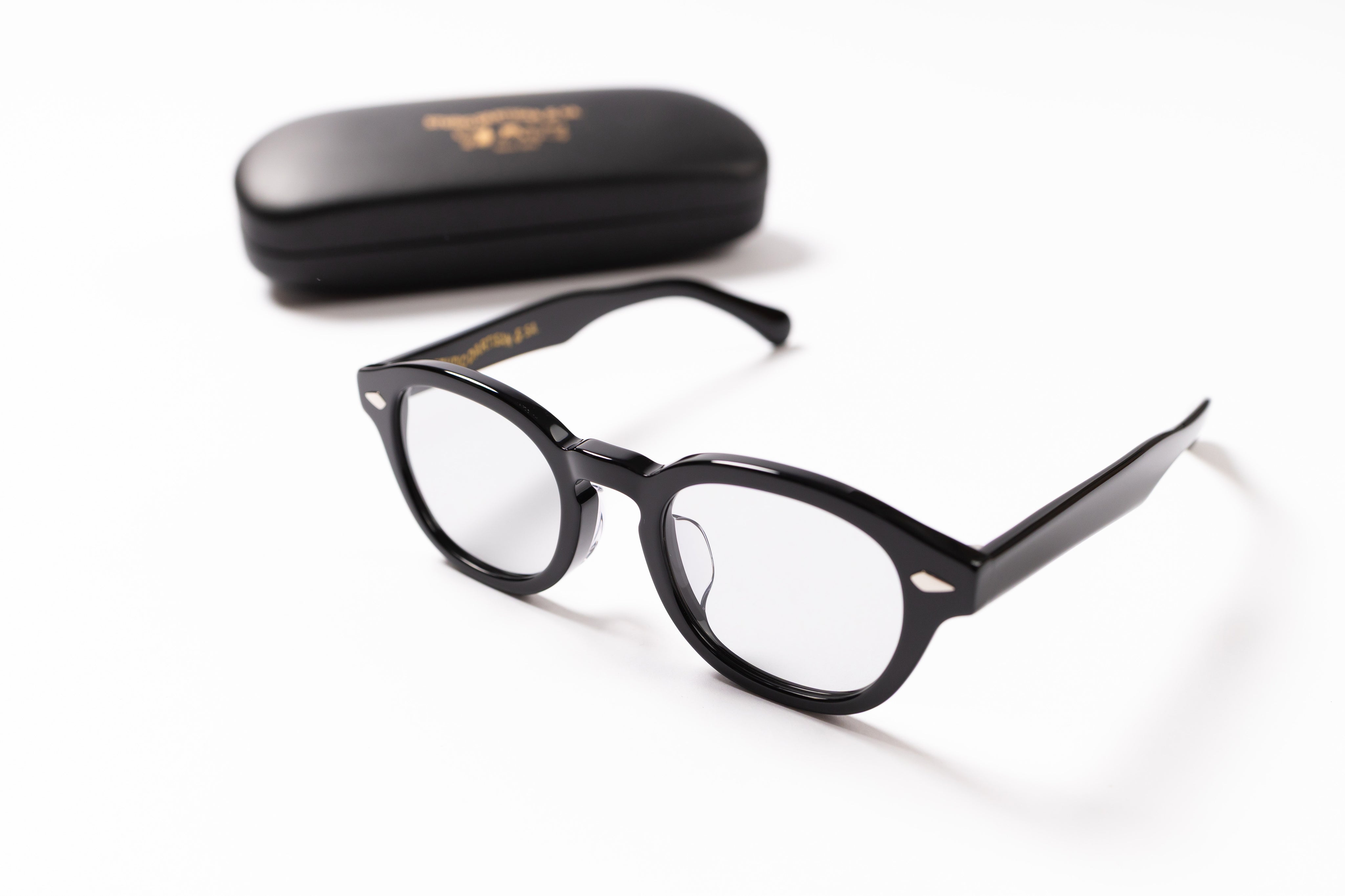 Black eyeglasses with a case on a white background