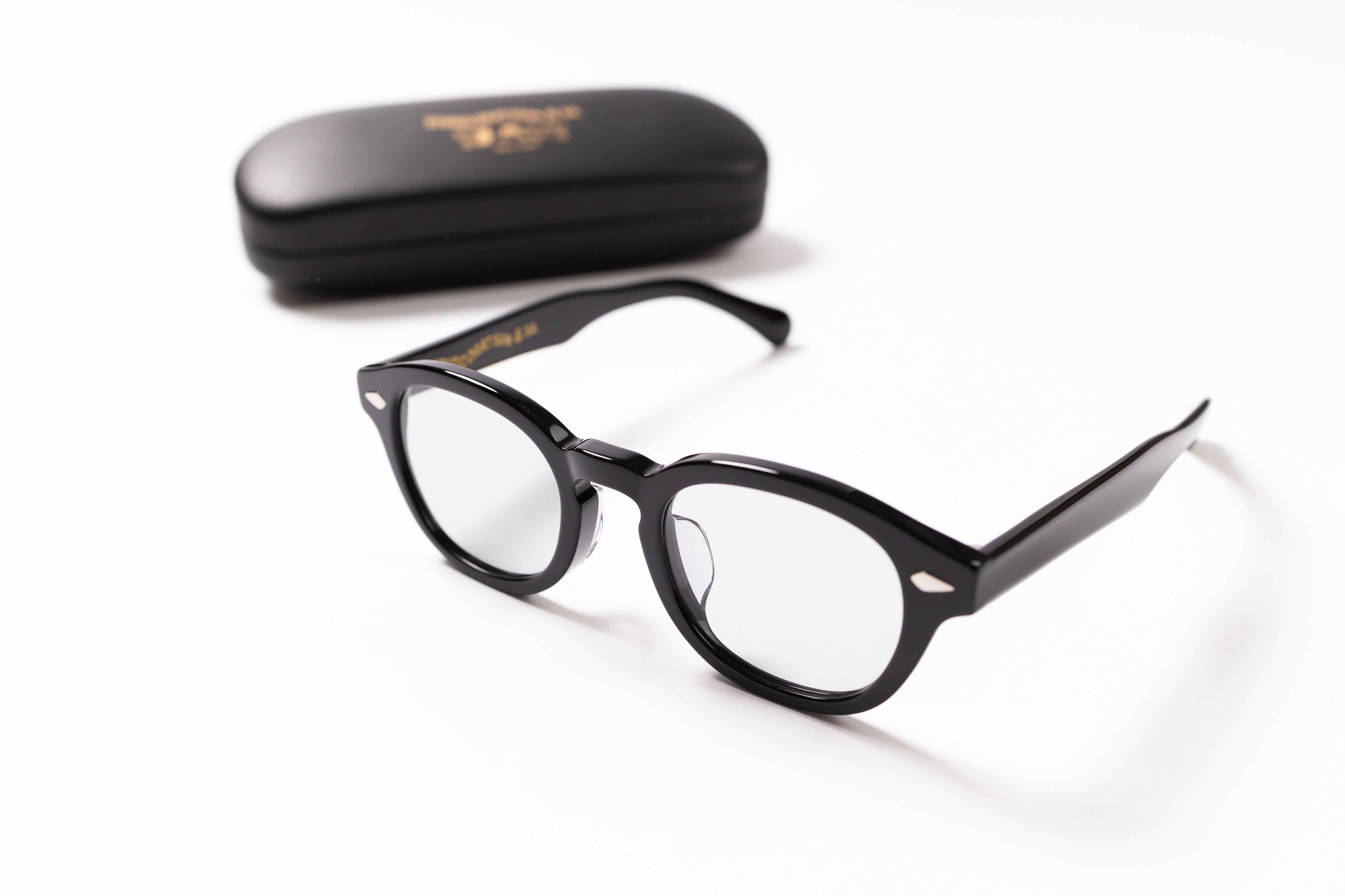 Black eyeglasses with a case on a white background