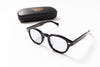 Black eyeglasses with a case on a white background