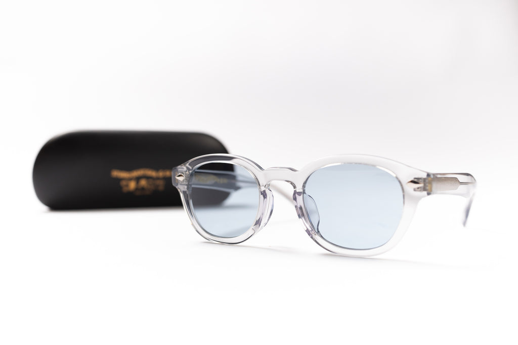 Sunglasses with a black case on a white background