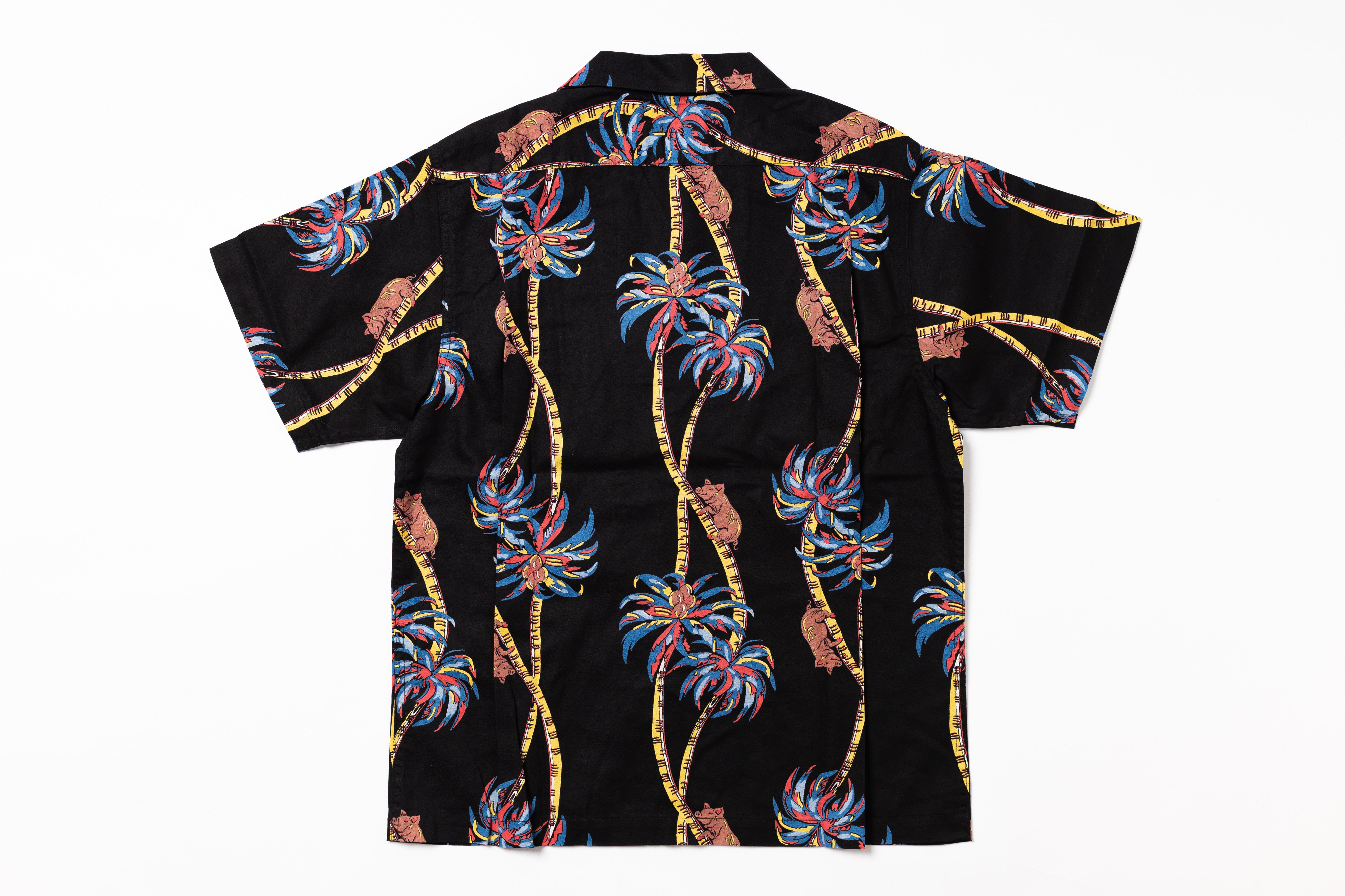 Black shirt with colorful palm tree pattern on a white background