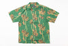 Green Hawaiian shirt with orange floral pattern on a white background