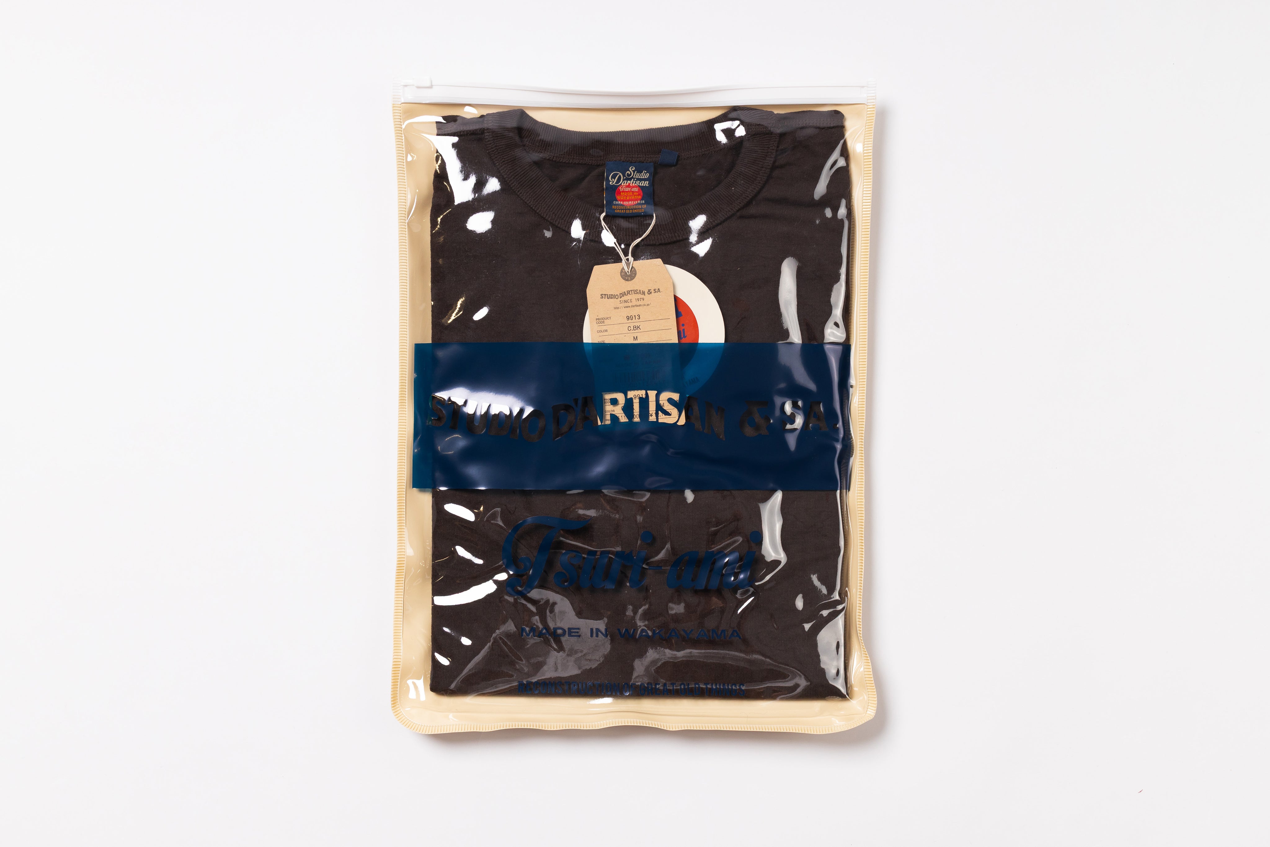 Packaged black t-shirt with a brand logo on a white background