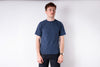 Man wearing a blue t-shirt against a white background