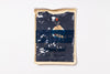 Navy blue t-shirt with 'Artisan' branding in a clear plastic bag on a white background
