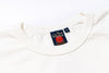 White shirt with a visible label on a white background