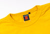 Yellow t-shirt with a brand label on a white background