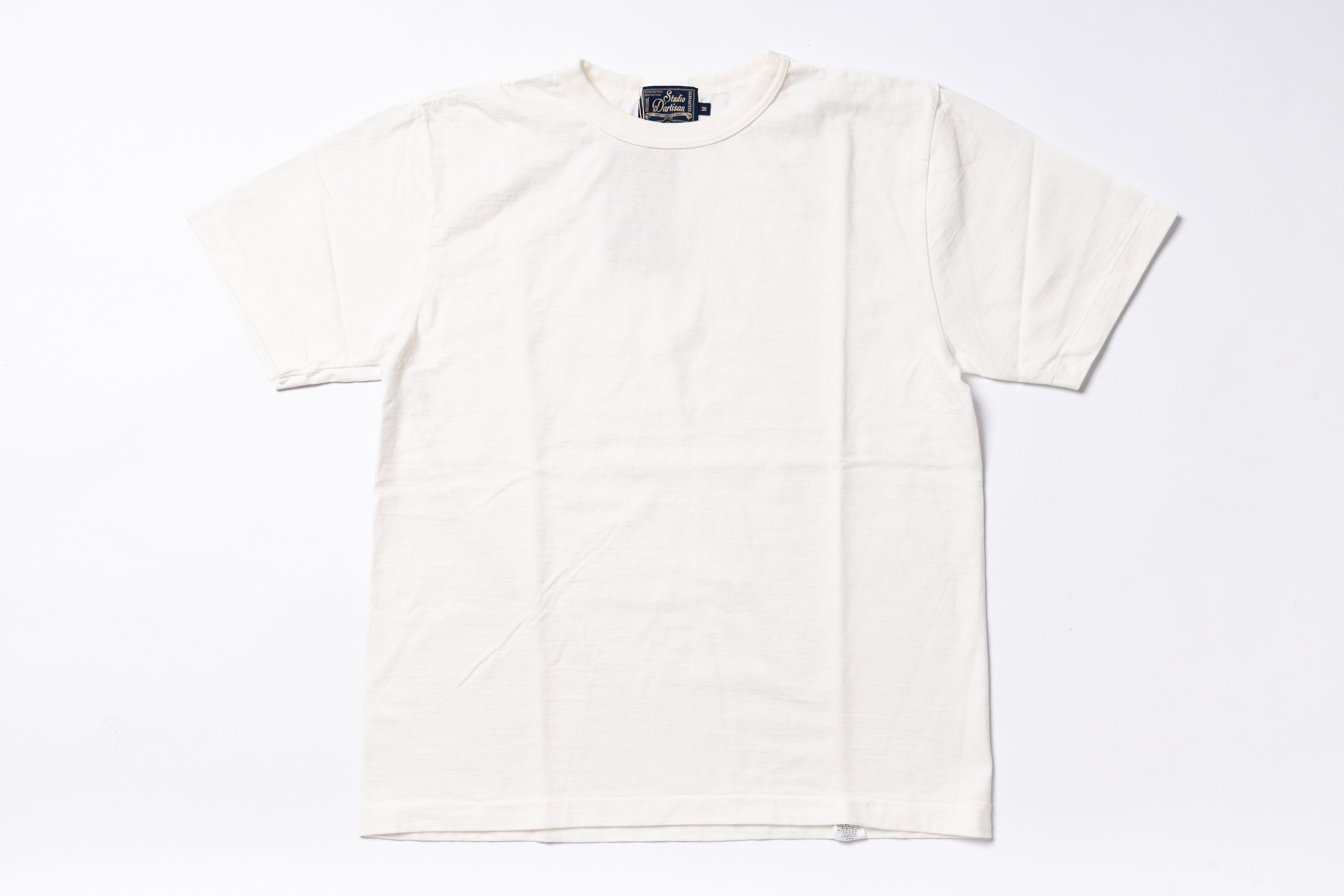 An off-white short-sleeve crewneck t-shirt laid flat against a clean white background.