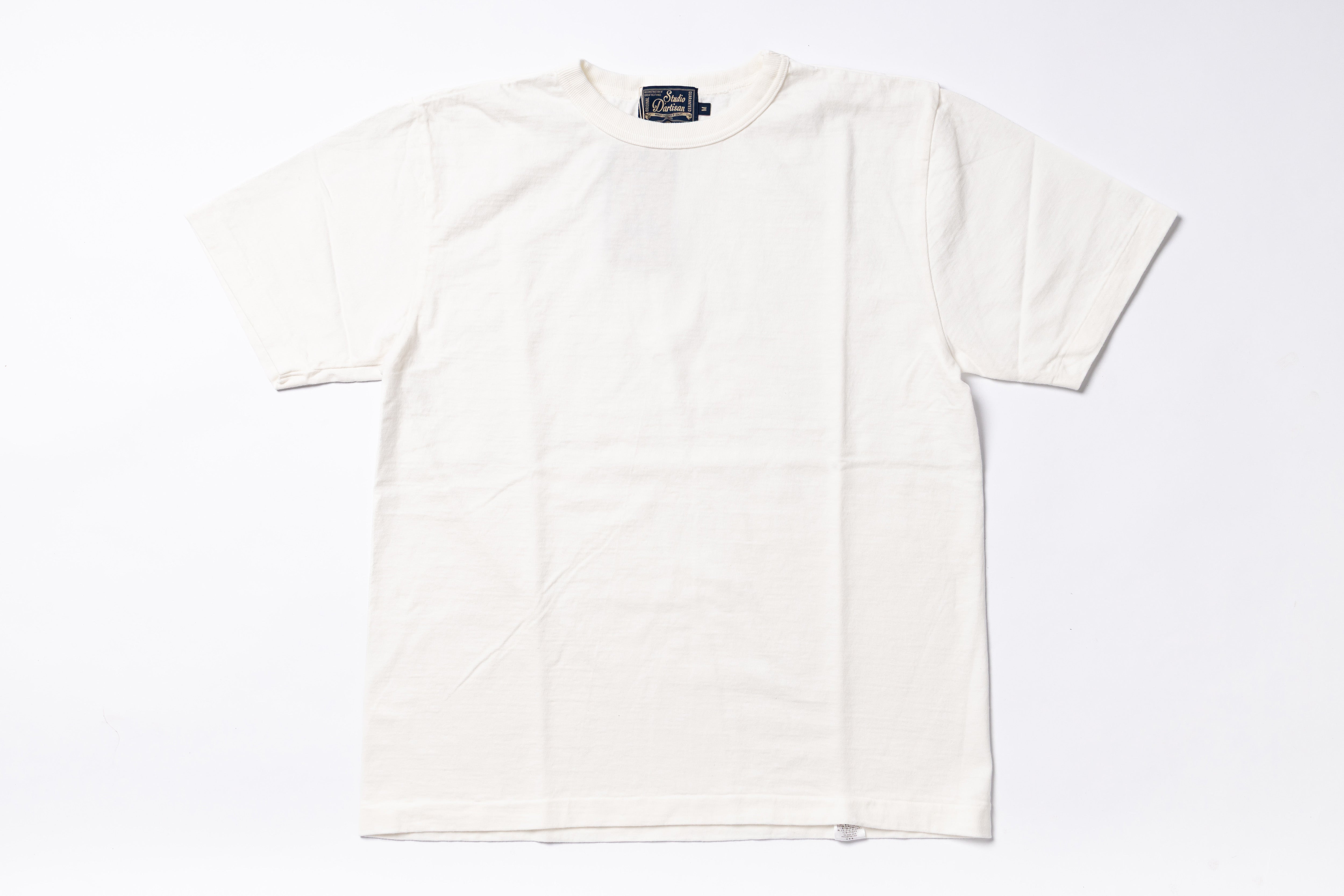 An off-white short-sleeve crewneck t-shirt laid flat against a clean white background.
