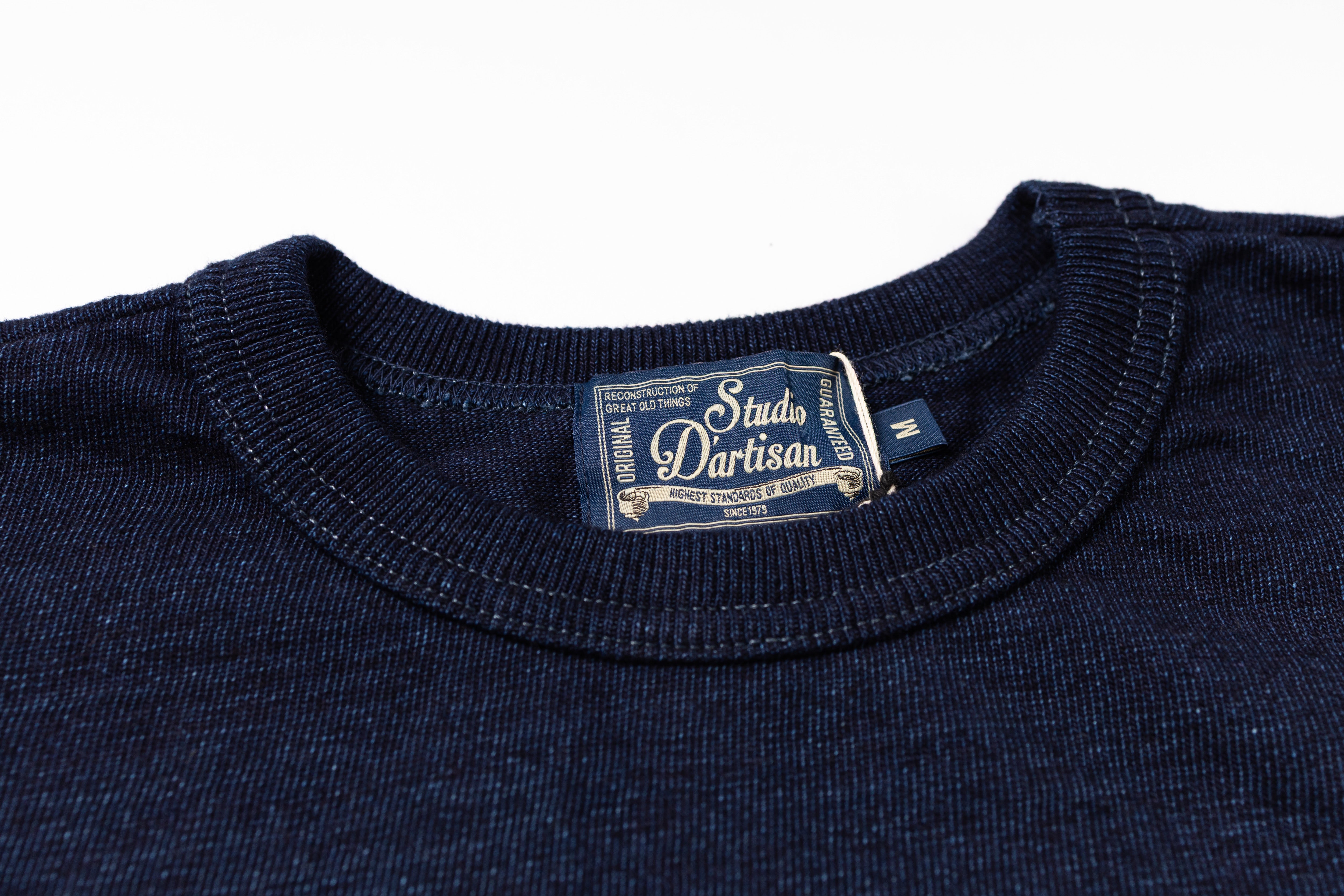 Navy blue shirt with a visible label on a white background