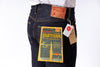 Dark blue jeans with a visible brand label on a white background