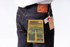Pair of blue jeans with a visible brand label on a white background