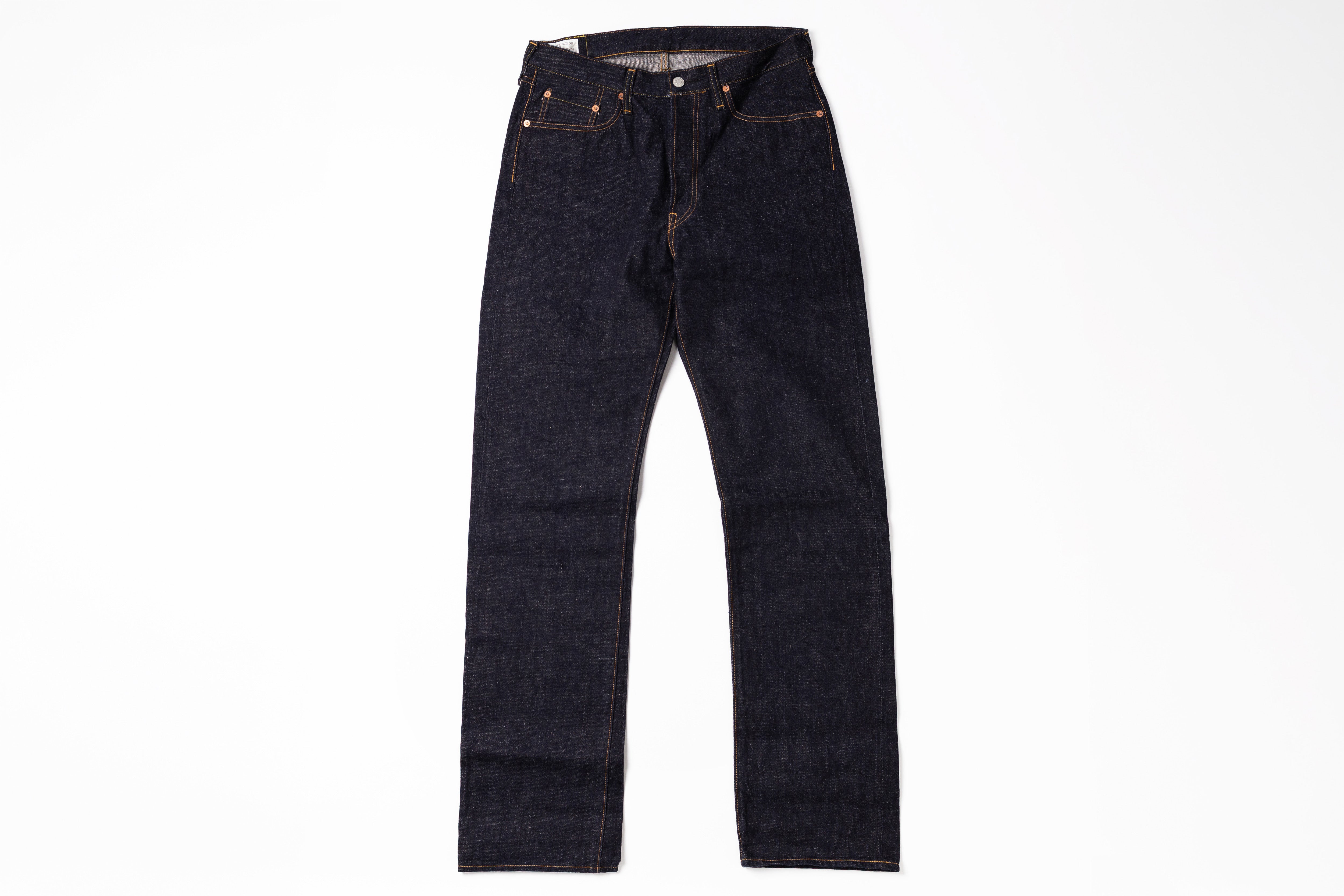 A pair of dark indigo straight-leg denim jeans laid flat against a solid white background.