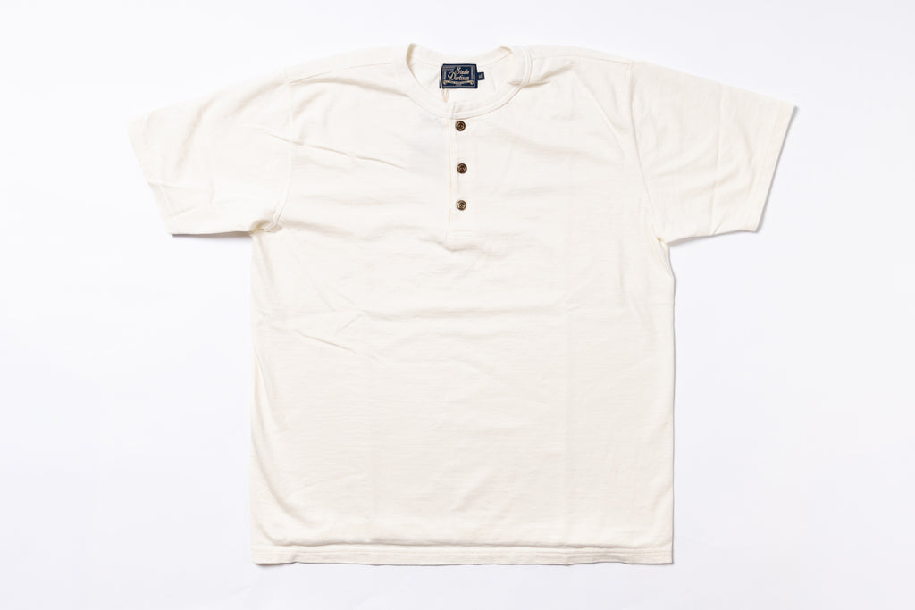 White henley shirt with buttons on a white background