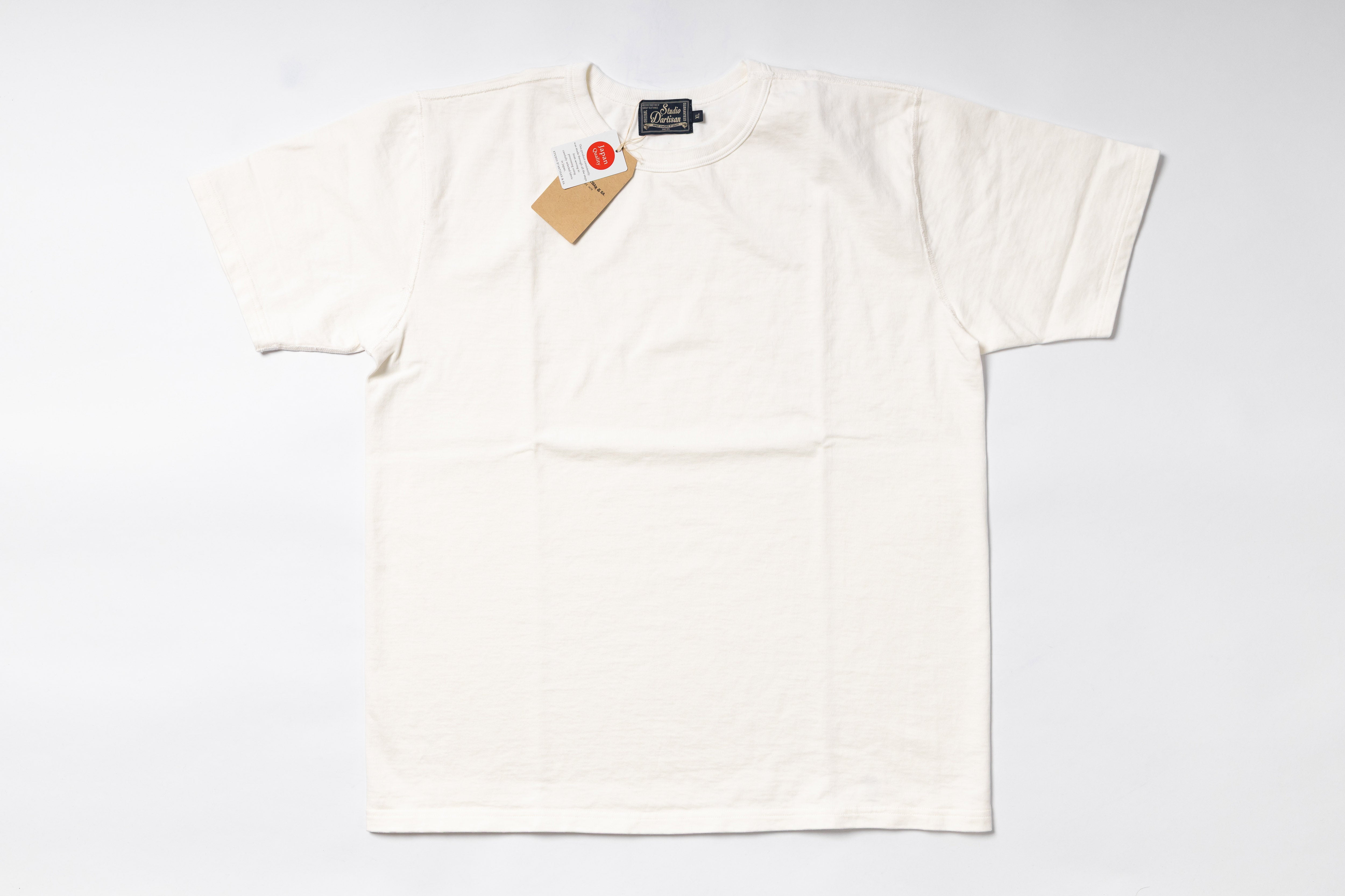 White t-shirt with a tag on a white background