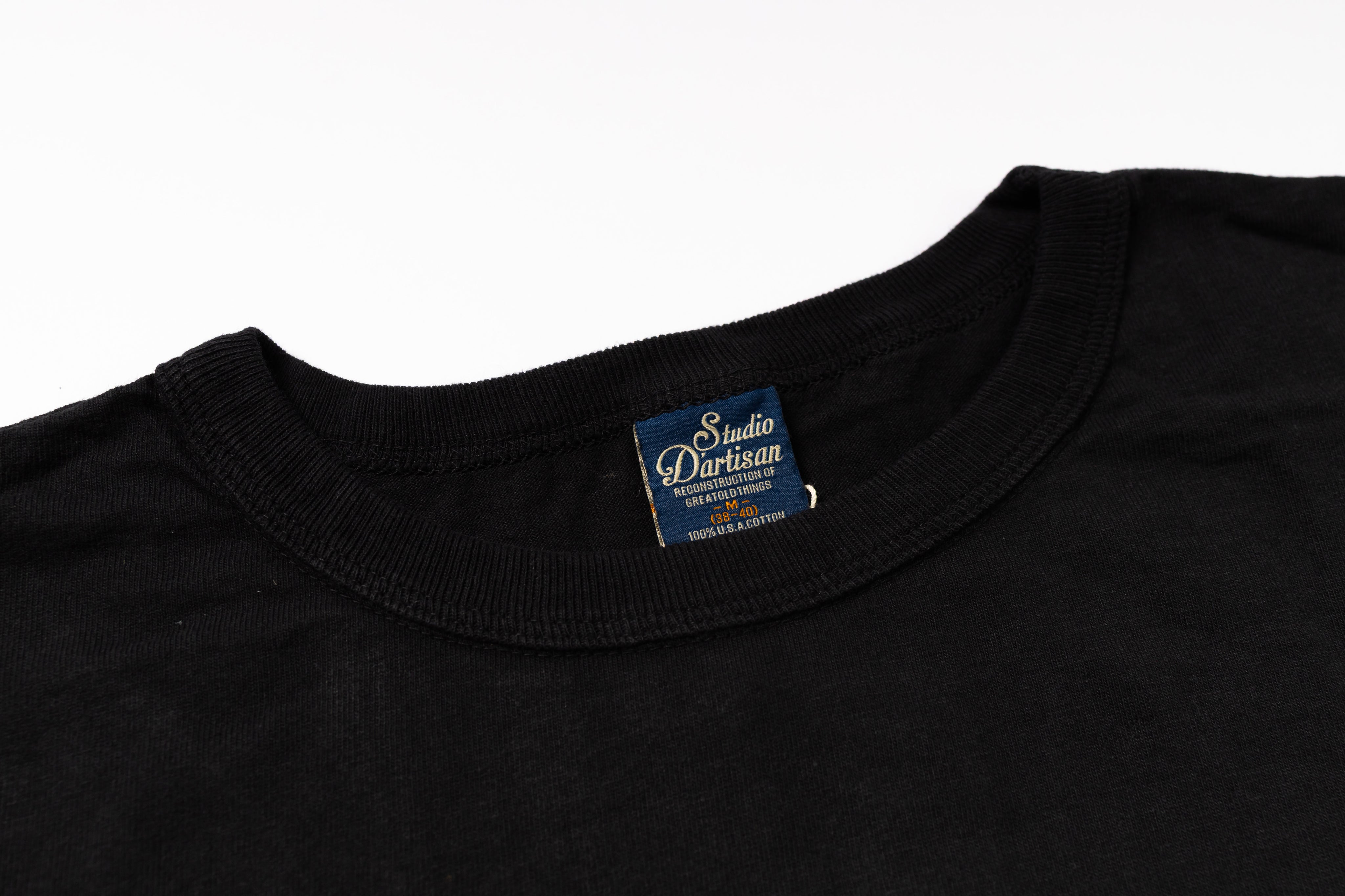 Black t-shirt with a visible brand label on a white background