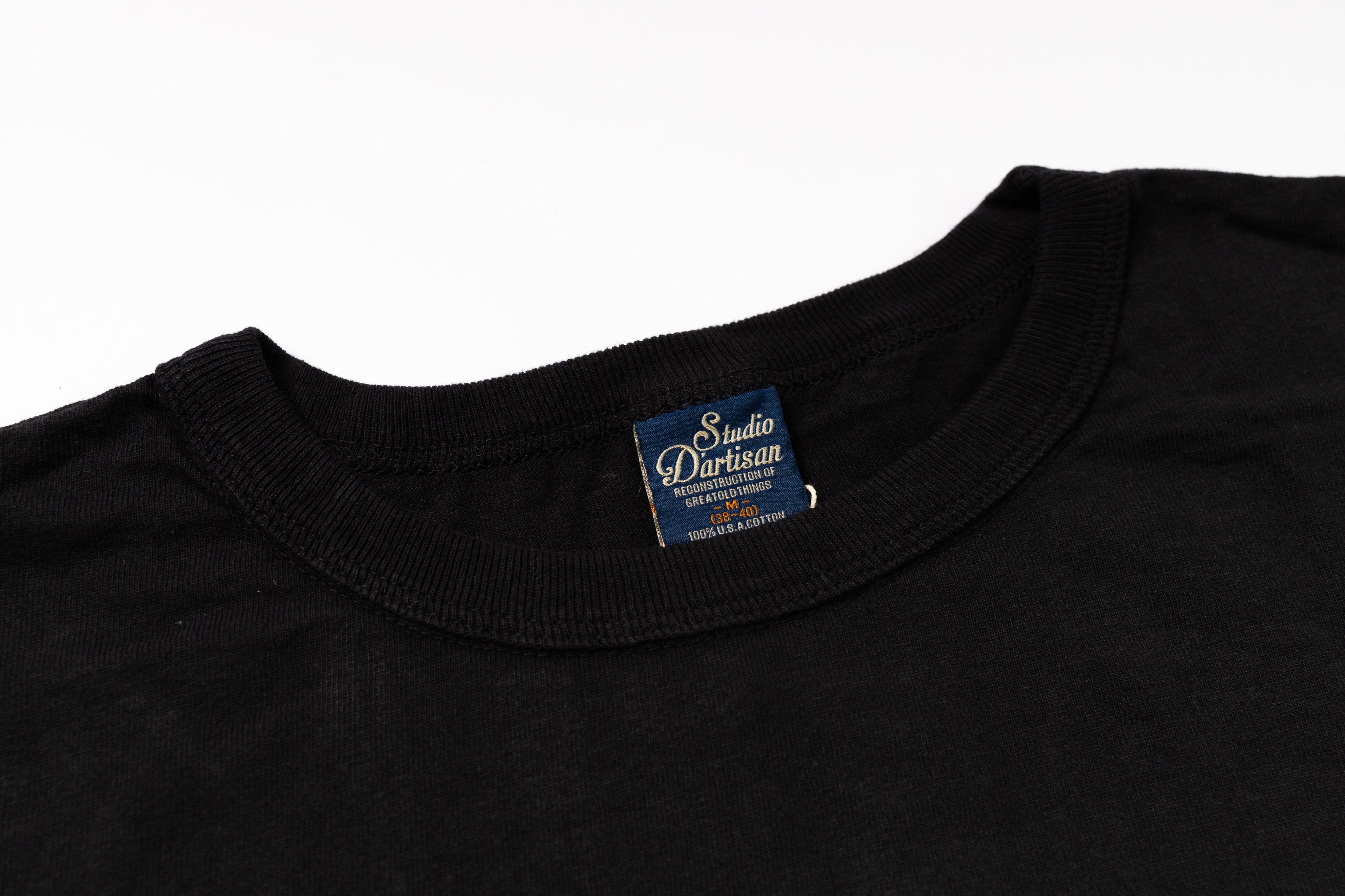 Black t-shirt with a visible brand label on a white background