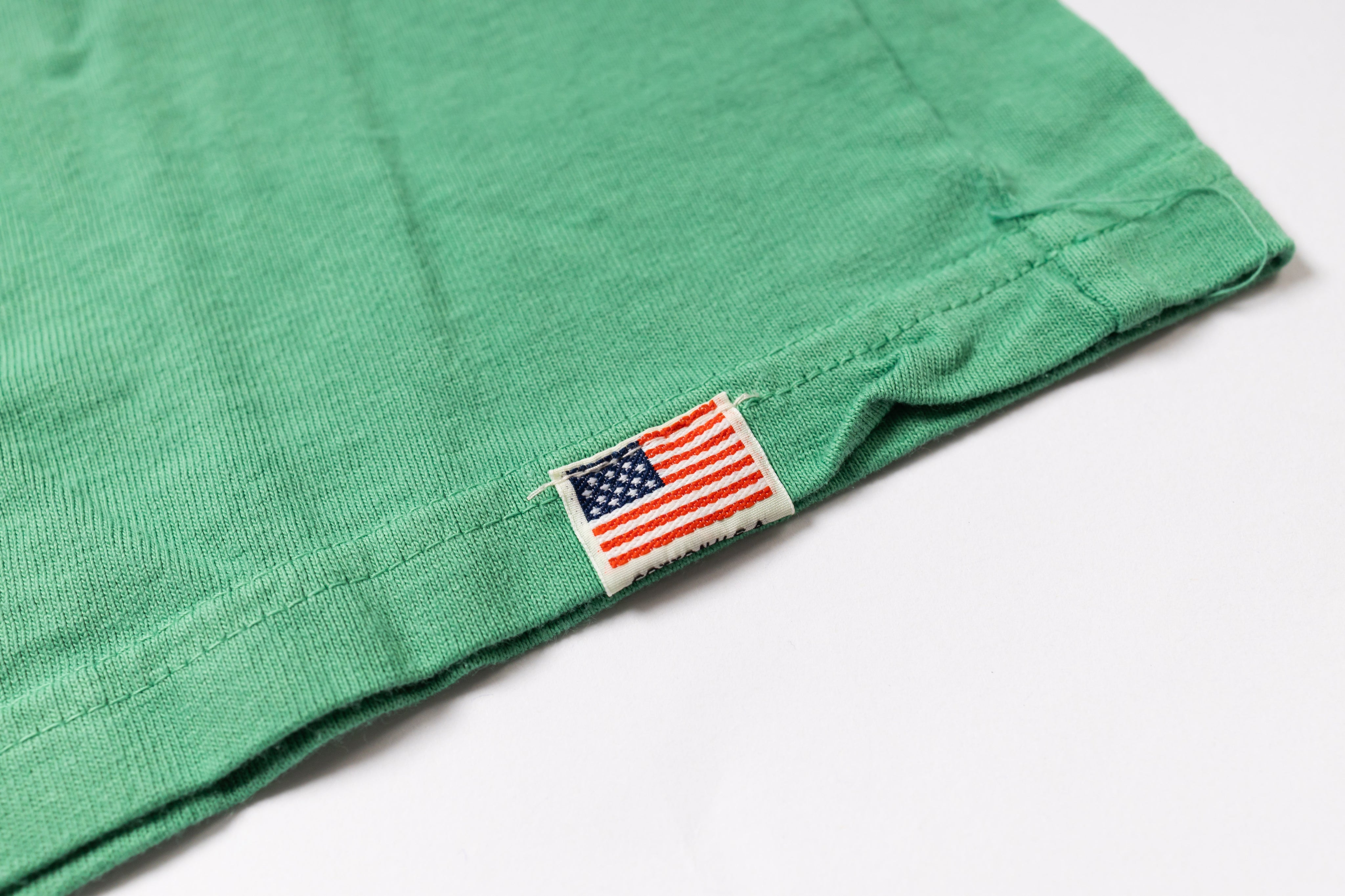 Green fabric with an American flag label on a white background