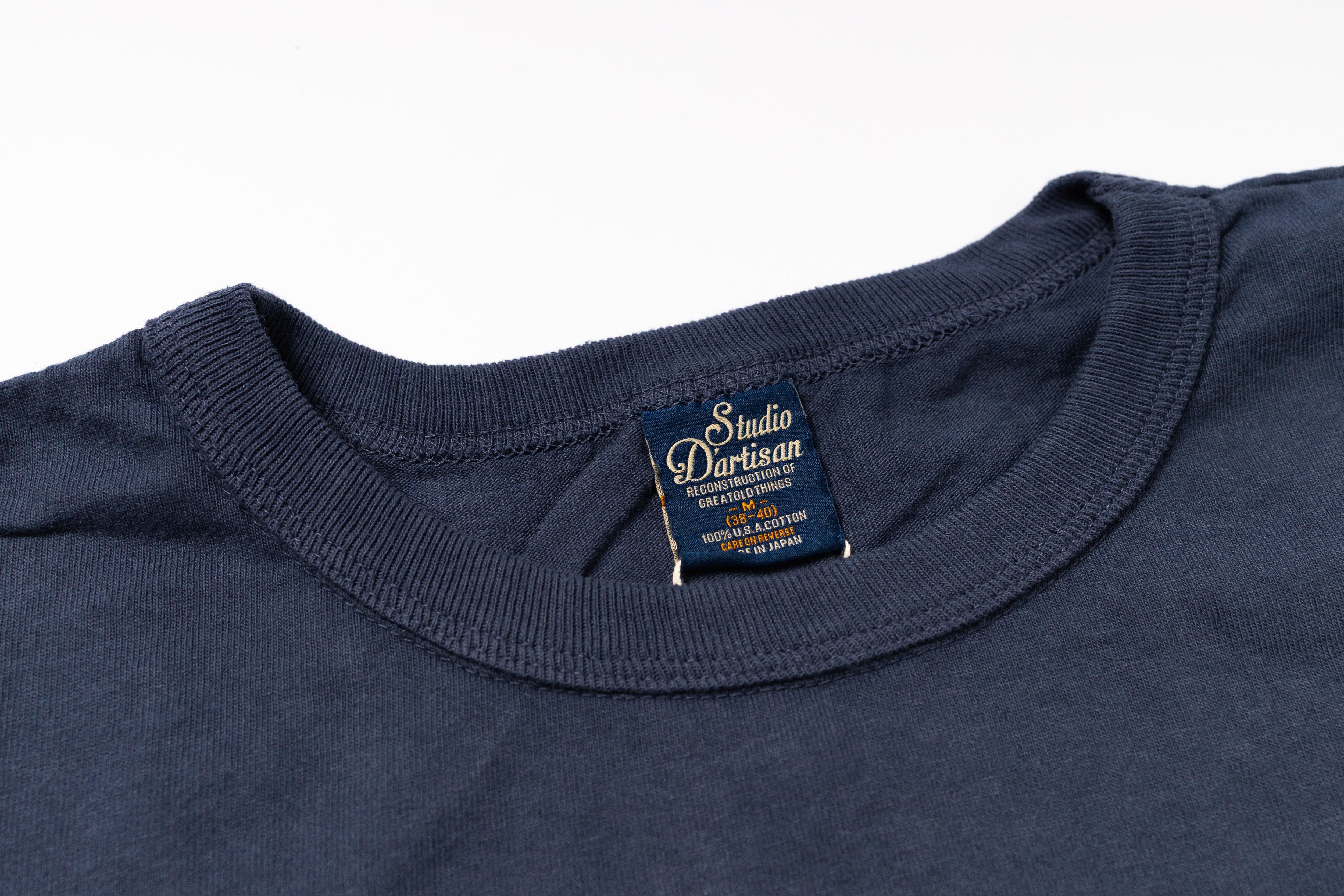 Navy blue t-shirt with a brand label on a white background