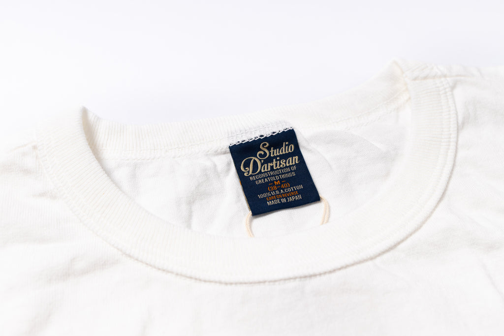 White t-shirt with a visible brand label on a white background