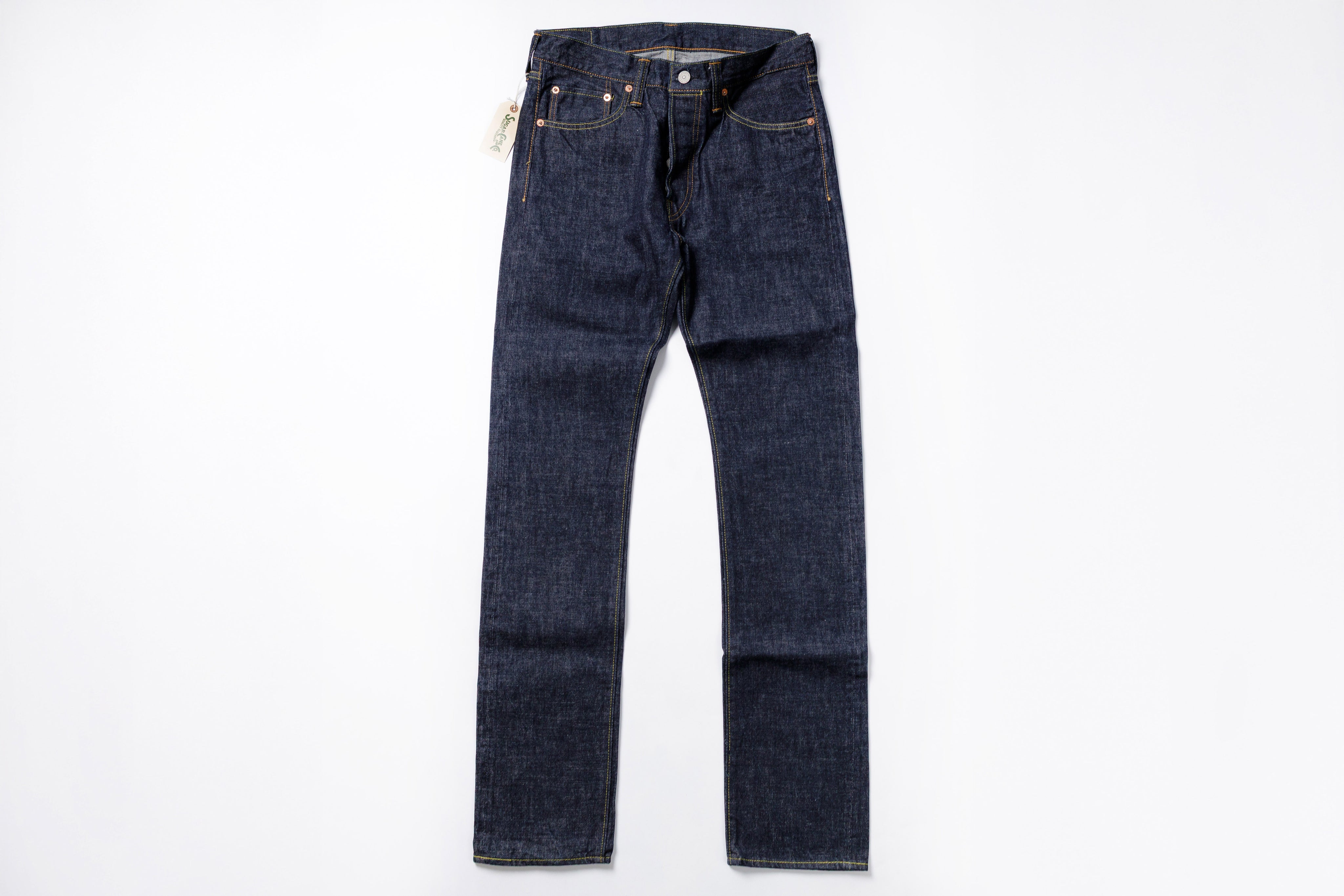 Pair of dark blue jeans on a white background