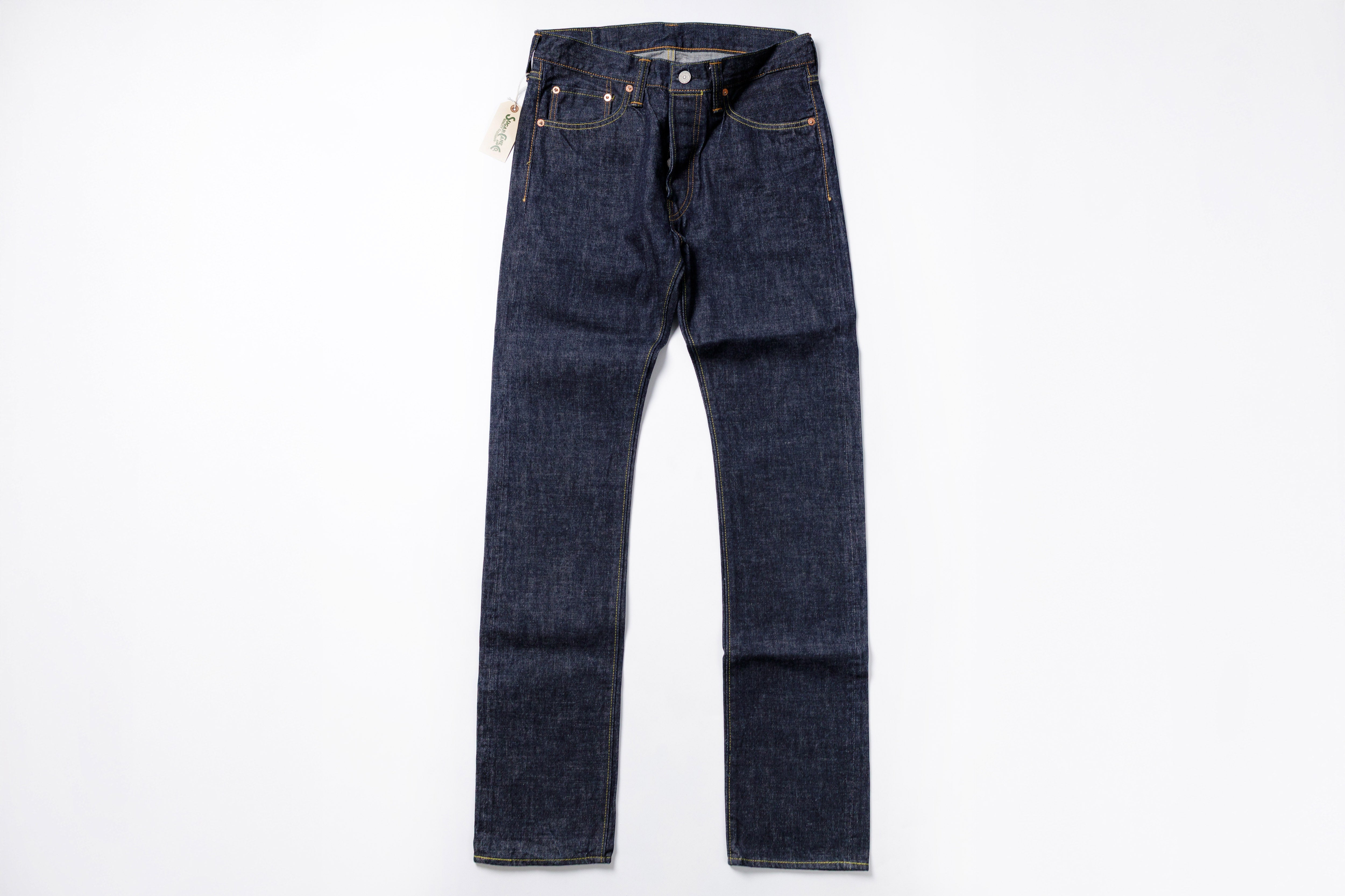 Pair of dark blue jeans on a white background