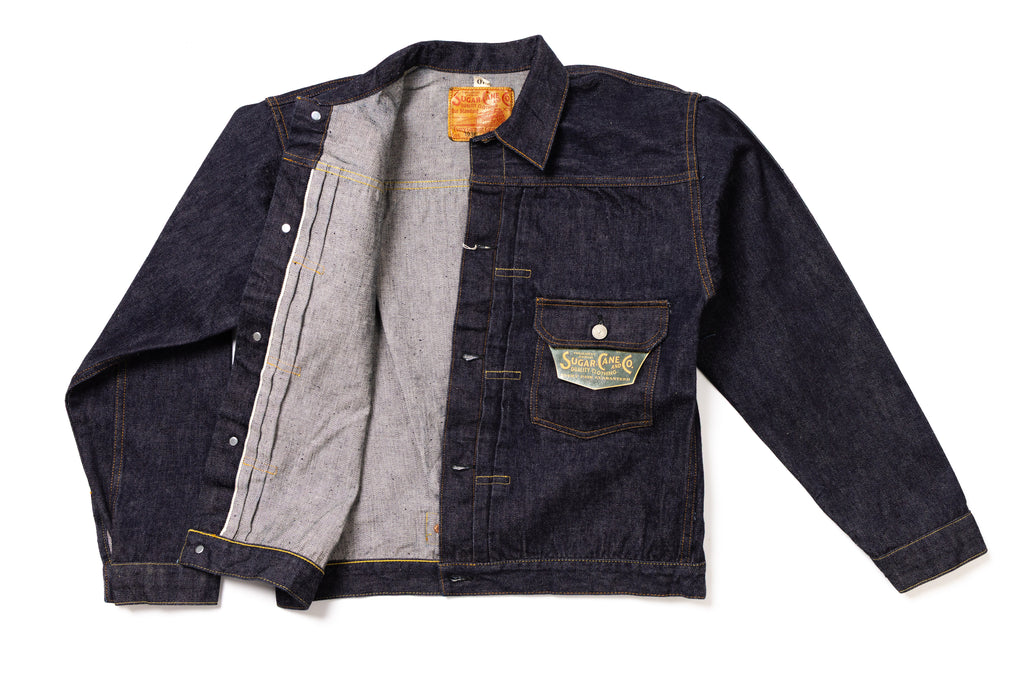 Denim jacket with a visible brand label on a white background