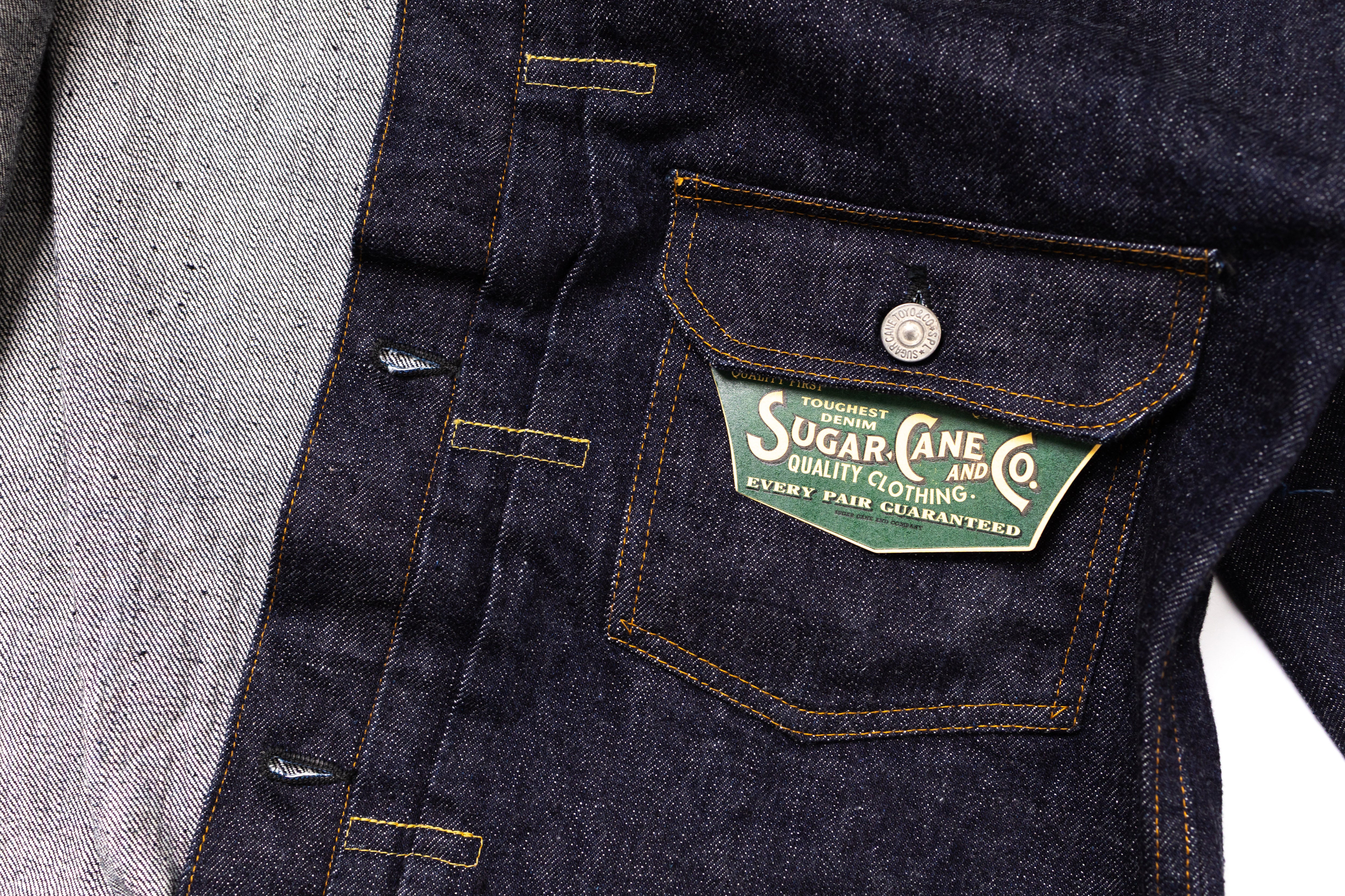 Denim jacket with a visible brand label on a white background