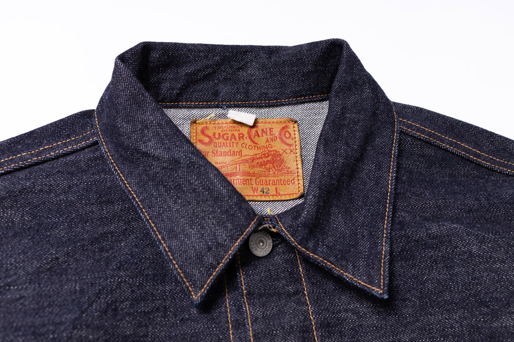 Collar of denim jacket on a white background 